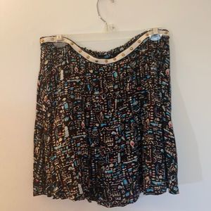 Black patterned mini skirt with studded waist